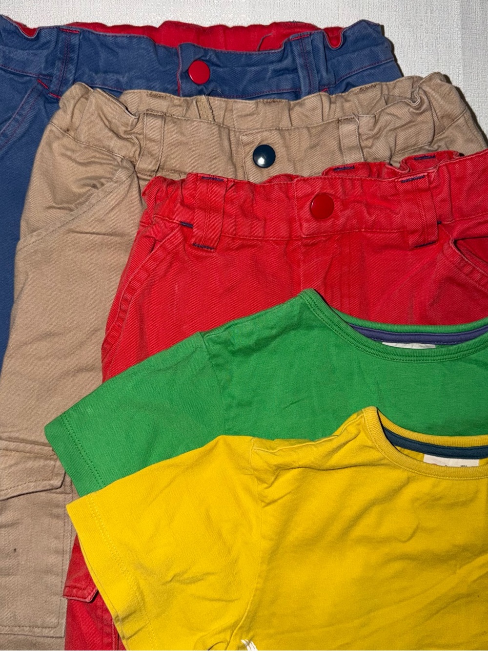 Piccalilly red, tan and blue pants and yellow and green t-shirts 5/6